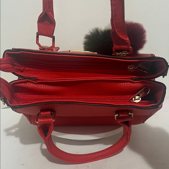Elegant Red Handbag with Pom-Pom Charm - Picture 4 of 5